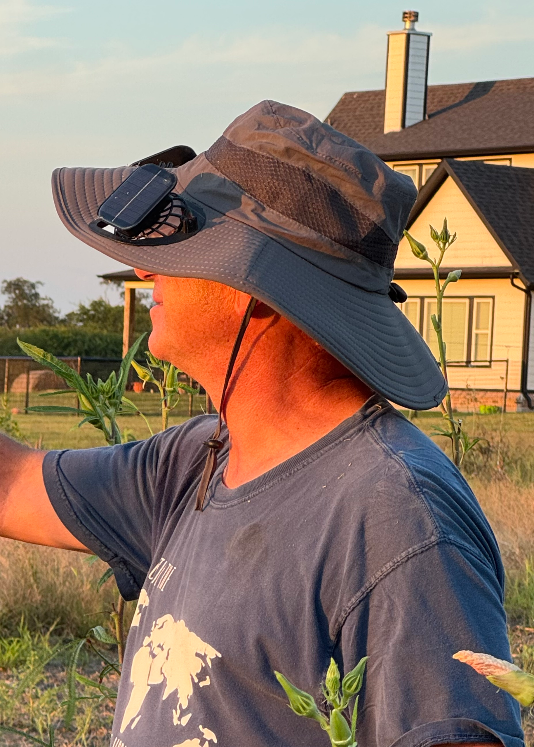 Jeff stays cool in the garden with this wide-brimmed hat with a built-in, solar powered fan.